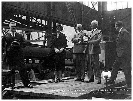 Camper & Nicholsons celebrates the firm's 150th Anniversary. Charles Nicholsons is the gentleman holding the presentation clock and which brother Arthur Nicholson is on his right.