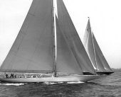 A photo from the fourth race of the 1937 America's Cup race.  Ranger is in the foreground and Endeavour II is in the background.  At the start of the race Endeavour II showed a faster start; however, she could never match Ranger's overall speed or the skill of Vanderbilt's leadership.  From the Edwin Levick Collection.