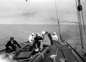 194-Deck view, Shamrock IV. The woman in the picture is the first woman to ever sail aboard a racing yacht. 1920.
